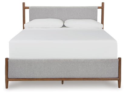 Lyncott Queen Upholstered Bed with Mirrored Dresser